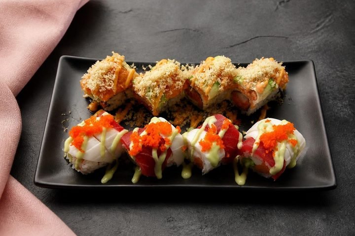 Two special rolls meal in a takeout tray